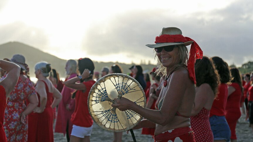 Musician on Byron Bay's Main Beach for V-Day, One Billion Rising celebrations