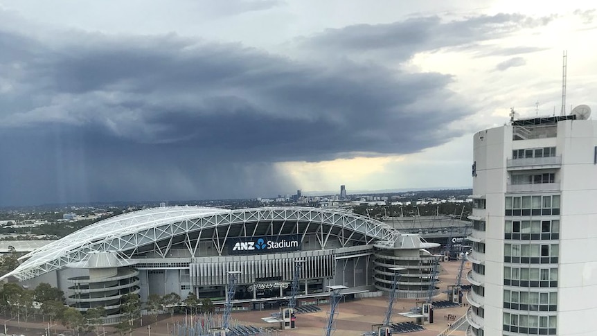 Storm clouds over ANZ Stadium at Sydney Olympic Park.
