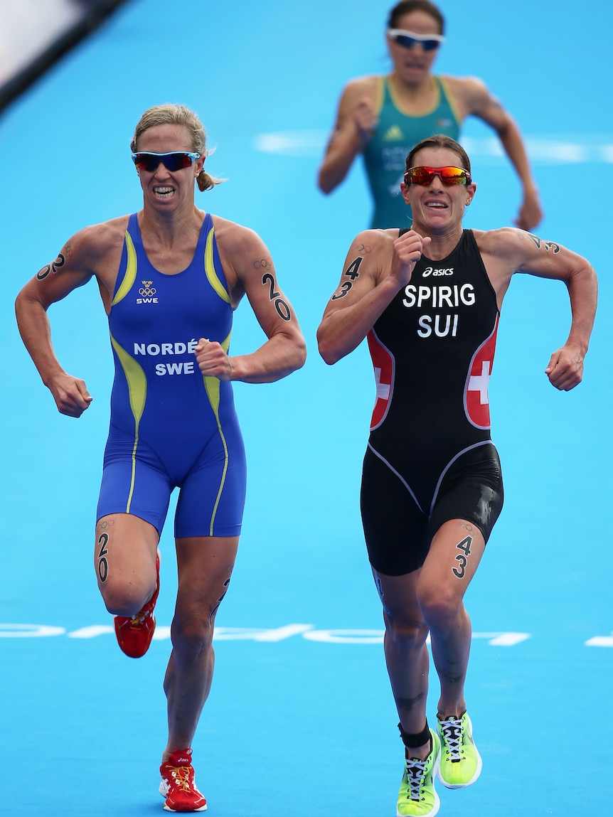 Lisa Norden of Sweden (L), Nicola Spirig of Switzerland (R), and Australia's Erin Densham