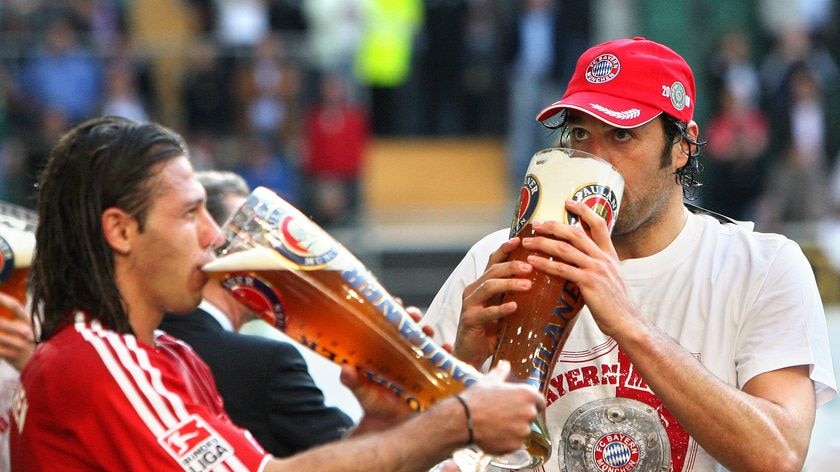 Taste of victory: Bayern Munich's Martin Demichelis (L) and Luca Toni celebrate winning the Bundesliga.