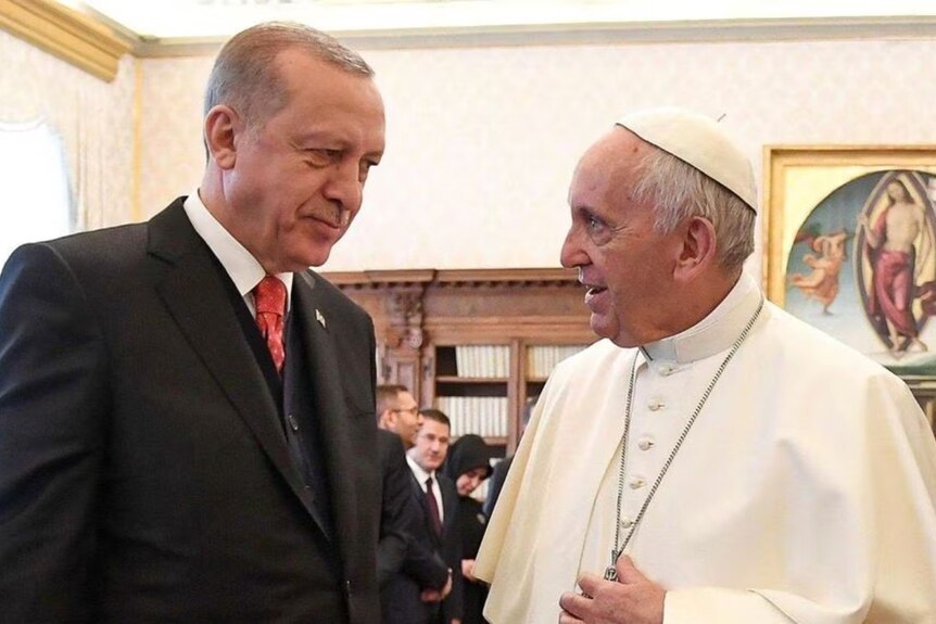 Pope Francis talks with Turkish President Tayyip Erdogan during a private audience