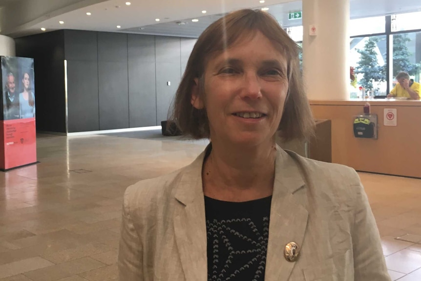 Dr Barbara Mintzes in an office building lobby