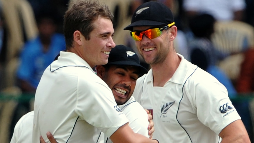 On fire ... Tim Southee (L) hugs team-mate Jeetan Patel after the dismissal of India captain MS Dhoni