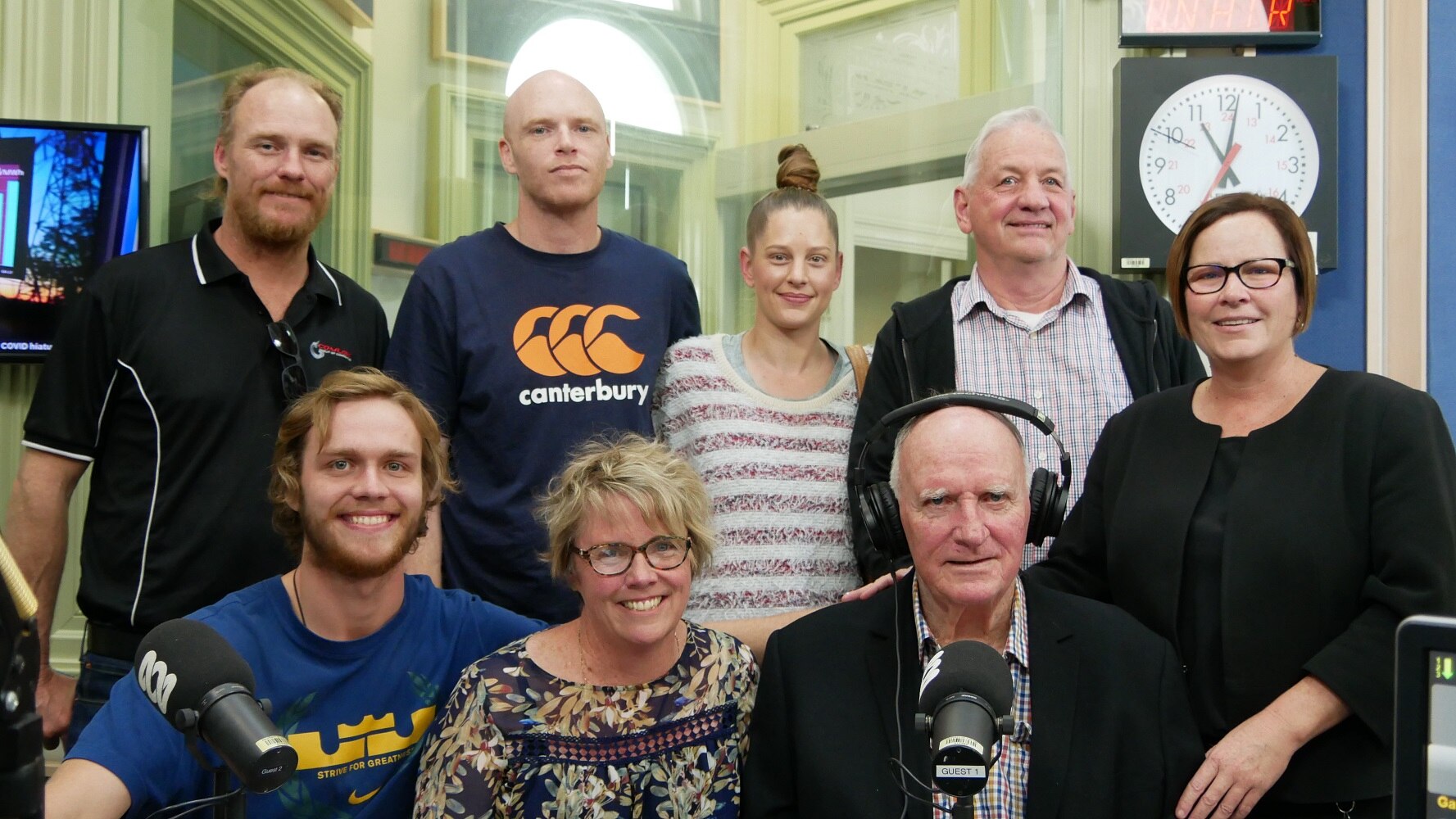 Family sits together in radio studio