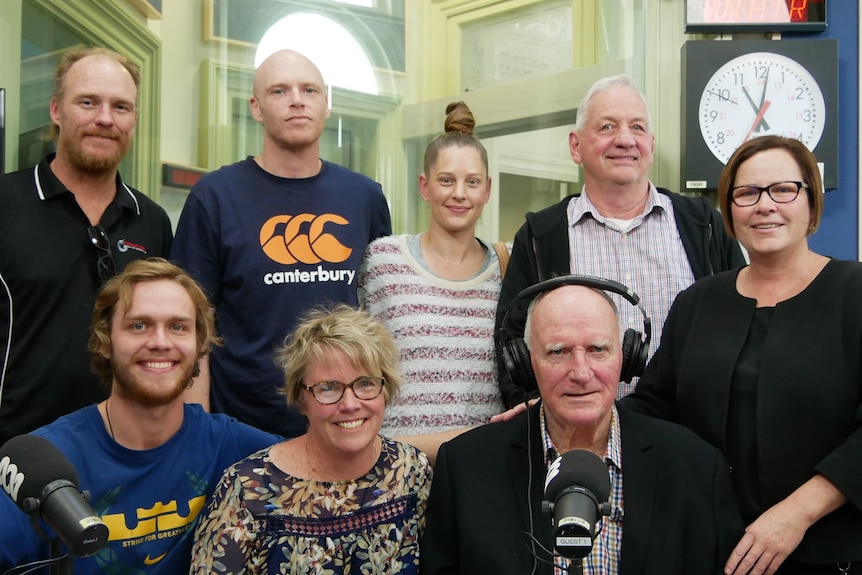 Family sits together in radio studio