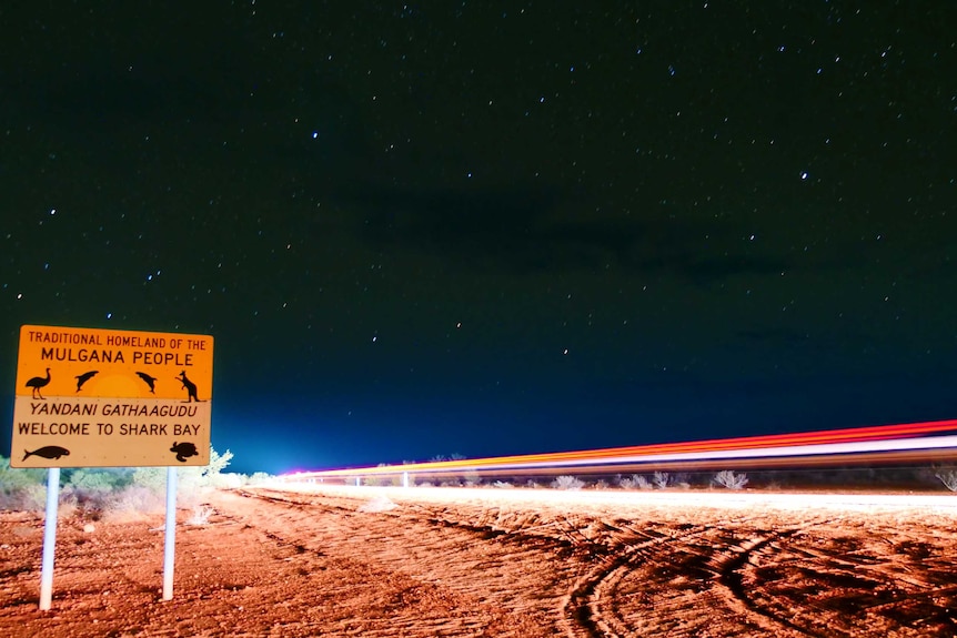 The sign post as you drive into Shark Bay at night.