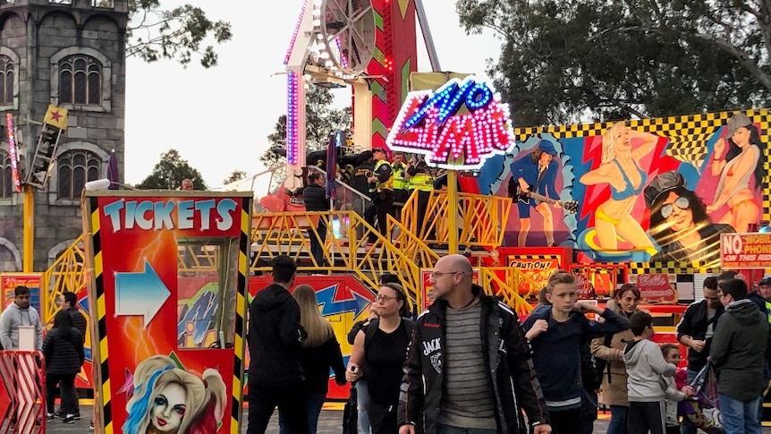 Emergency services attend a patient on the No Limit ride at the Royal Adelaide Show.