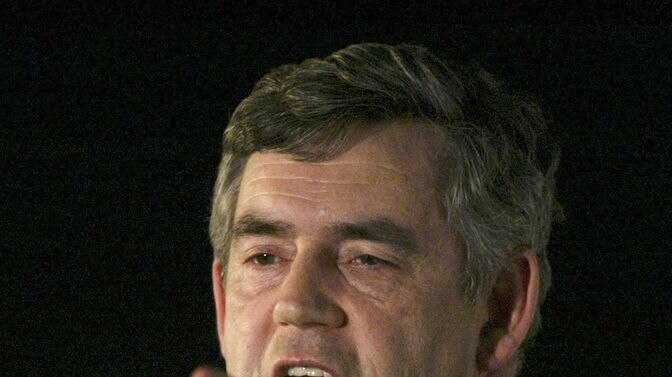 Gordon Brown gestures during a speech.