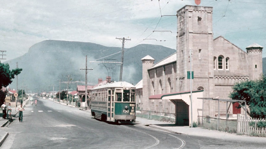 Hobart's 130 tram travelling on a road at Glenorchy in 1959