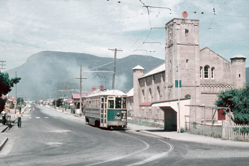 Hobart's 130 tram travelling on a road at Glenorchy in 1959