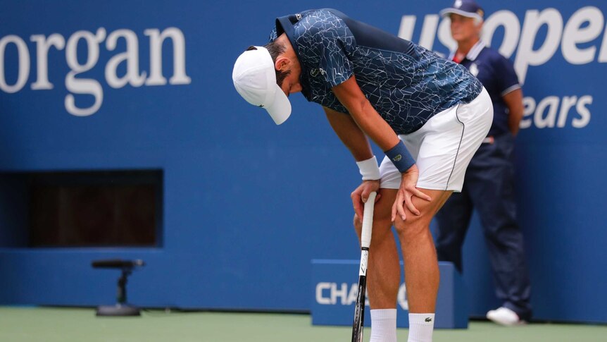 Novak Djokovic, of Serbia, takes a moment behind baseline against Marton Fucsovics at the US Open.