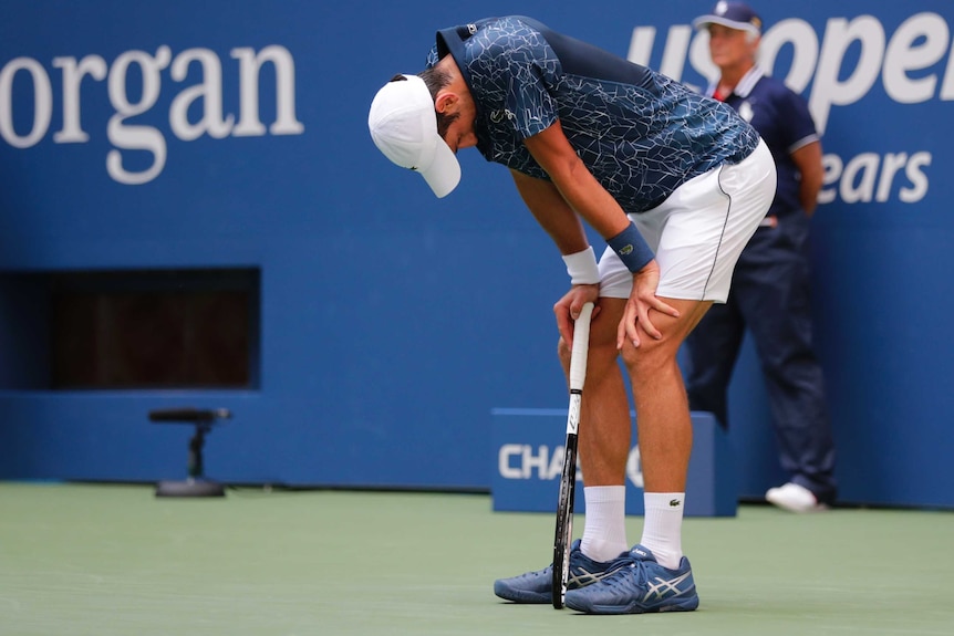 Novak Djokovic, of Serbia, takes a moment behind baseline against Marton Fucsovics at the US Open.