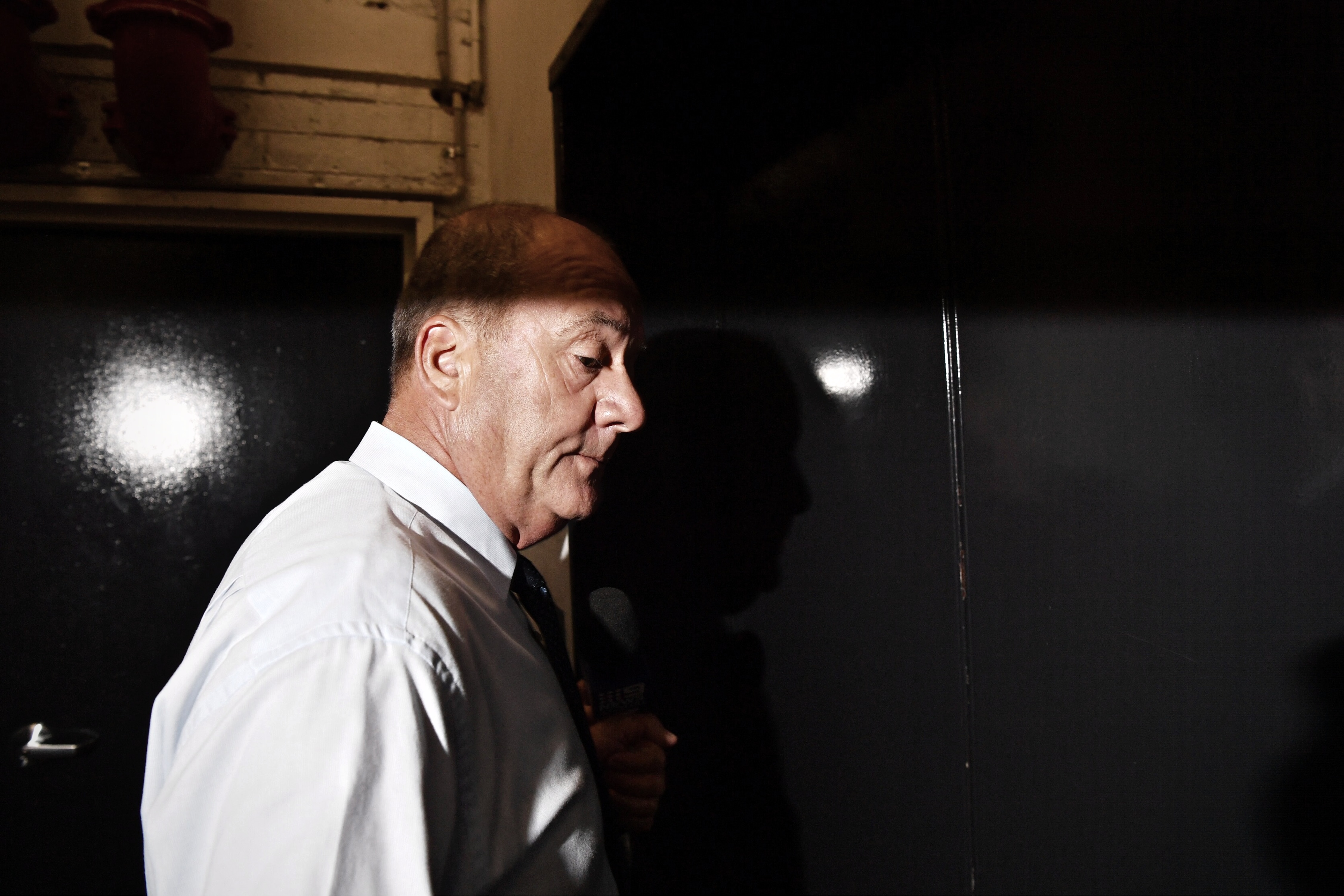 Shadowy image of Daryl Maguire, bald and on a profile