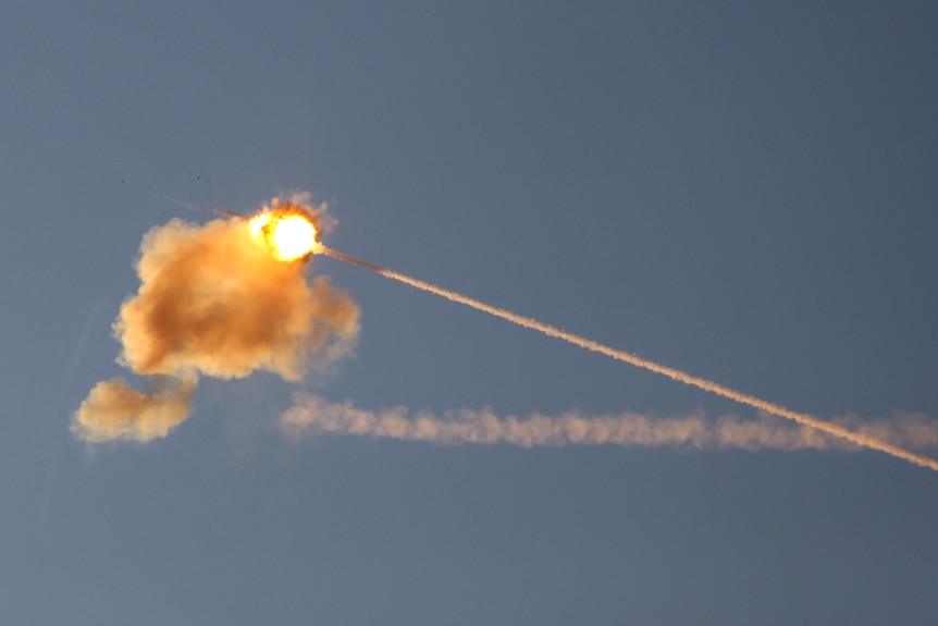 A mid-air explosion as Israeli's Iron Dome anti-missile system intercepts a rocket launched from the Gaza Strip