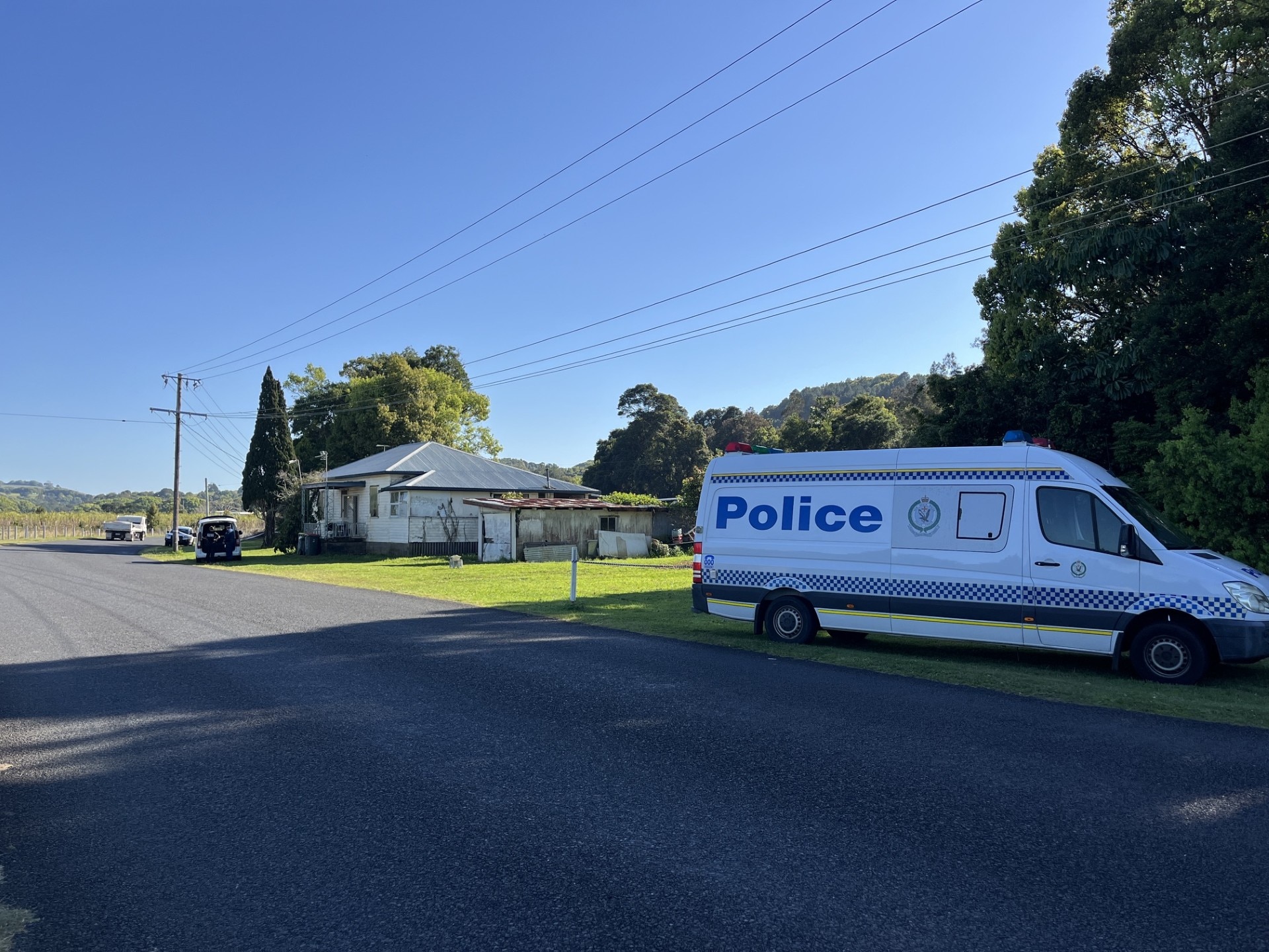 Woman charged with murder after body found in creek on NSW north coast