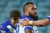 Dogs on top ... Frank Pritchard celebrates with his team-mates after scoring a try
