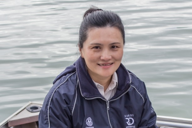 Qifeng Ye collecting data on the River Murray