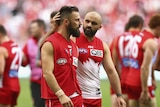Sydney's Nick Malceski is consoled by team-mate Rhyce Shaw after leaving the game against Fremantle.