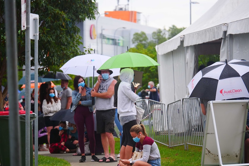 People queueing outside COVID-19 testing clinic at Robina on the Gold Coast.