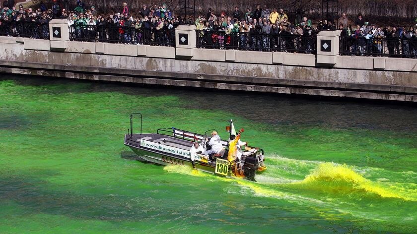 Journeymen Plumbers dye the Chicago River green to celebrate the start of St Patrick's Day