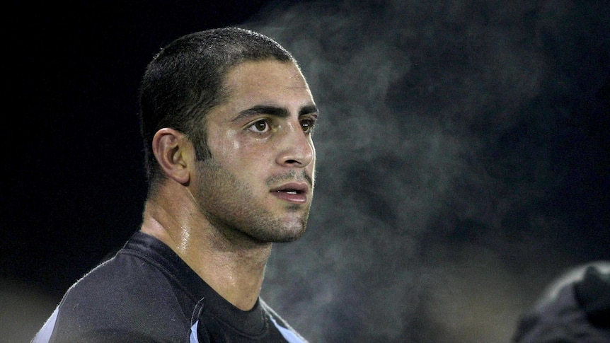 Mannah watches from sidelines in 2009