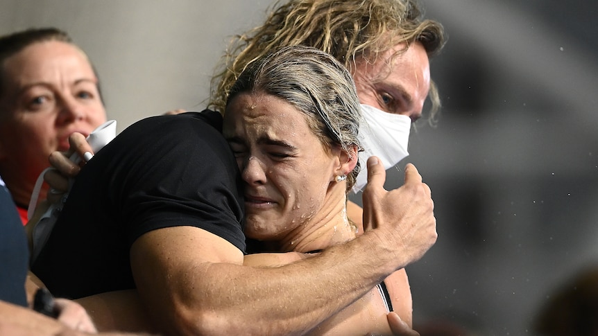 Shayna Jack cries as she is hugged by her coach Dean Boxall