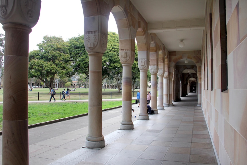 Students walk through the Great Court at the University of Queensland.