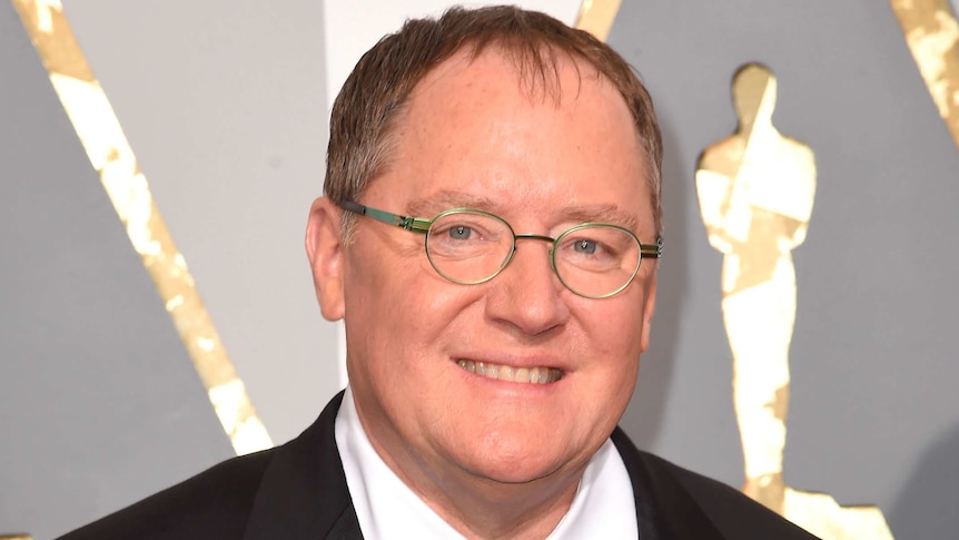 Close-up of Pixar co-founder John Lasseter in a black suit with a bow tie.