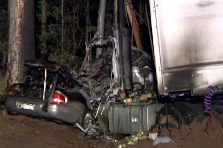 Aftermath of crash between car and a semi-trailer near Aratula.