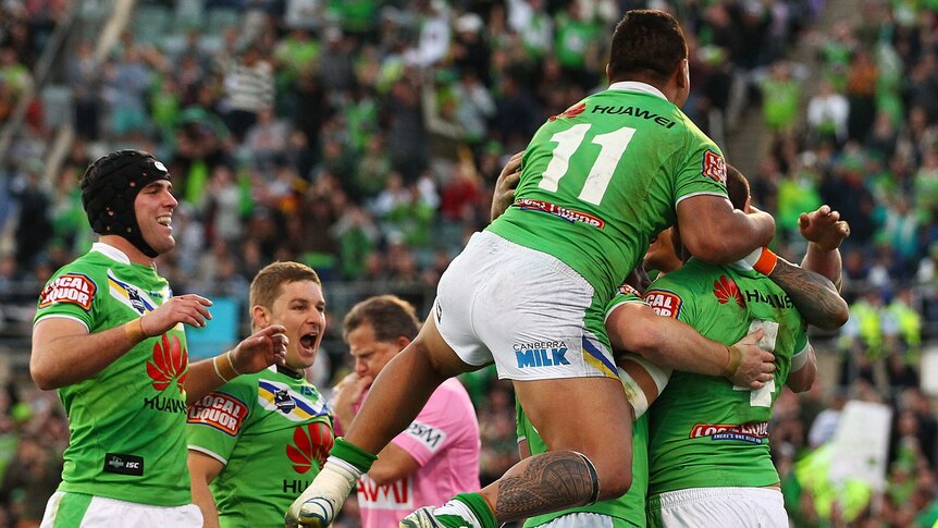 The Raiders celebrate a try by Blake Ferguson in their impressive finals win over Cronulla.