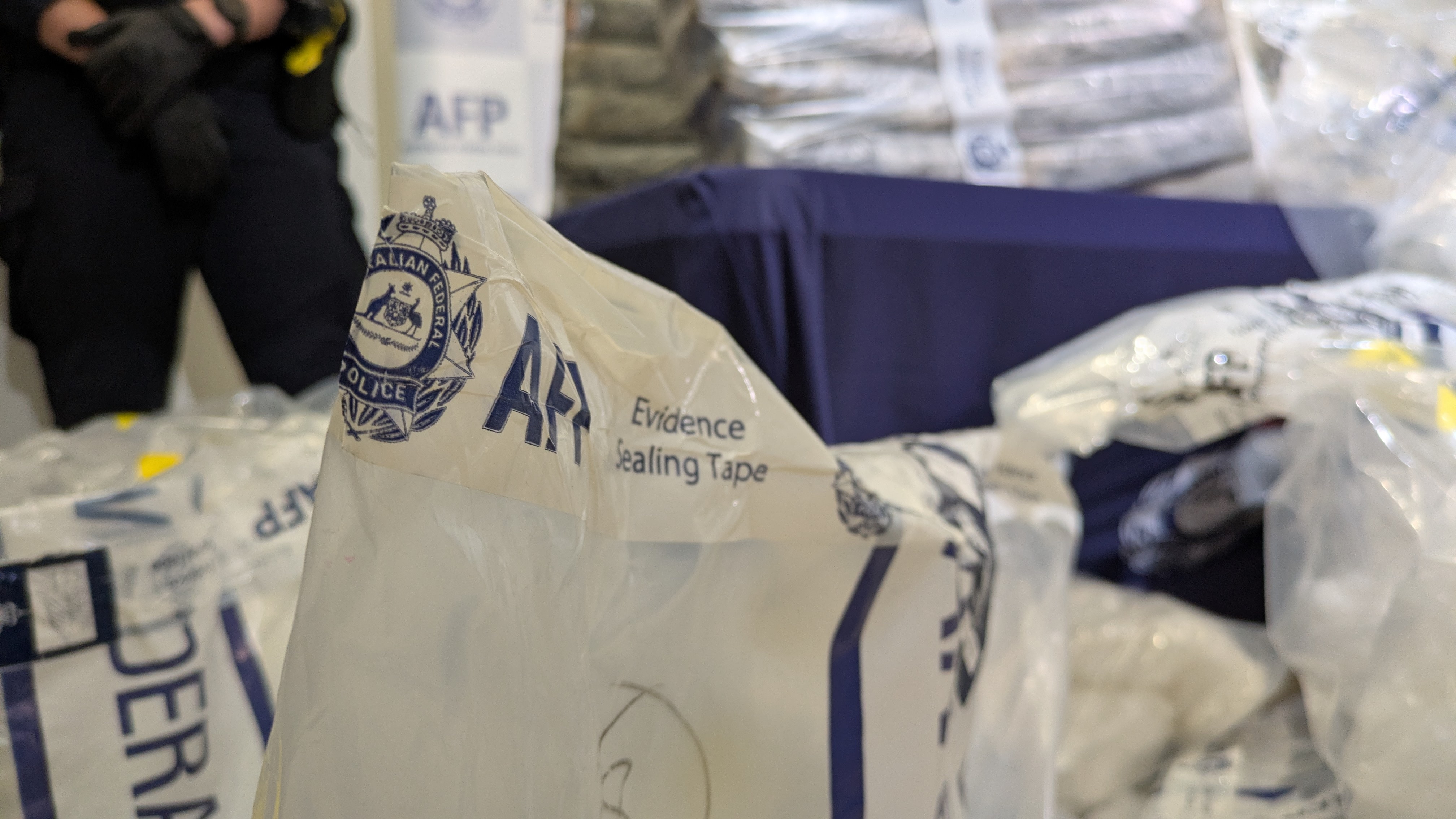 A close up of AFP evidence bags full of drugs. 