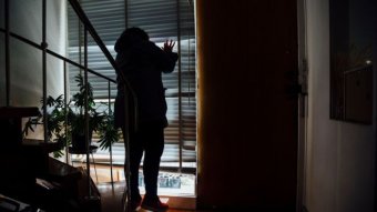 A woman looking out of a window