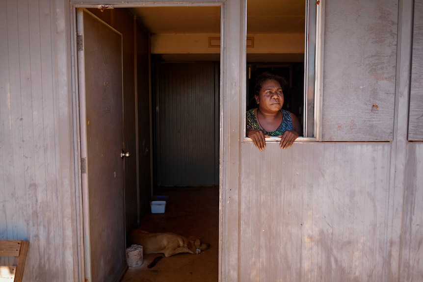 Mwurryambtj Gurruwiwi looking out the window of her home in Birritjimi