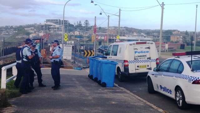 Police investigate the discovery of a body at Newcastle's Bar Beach.