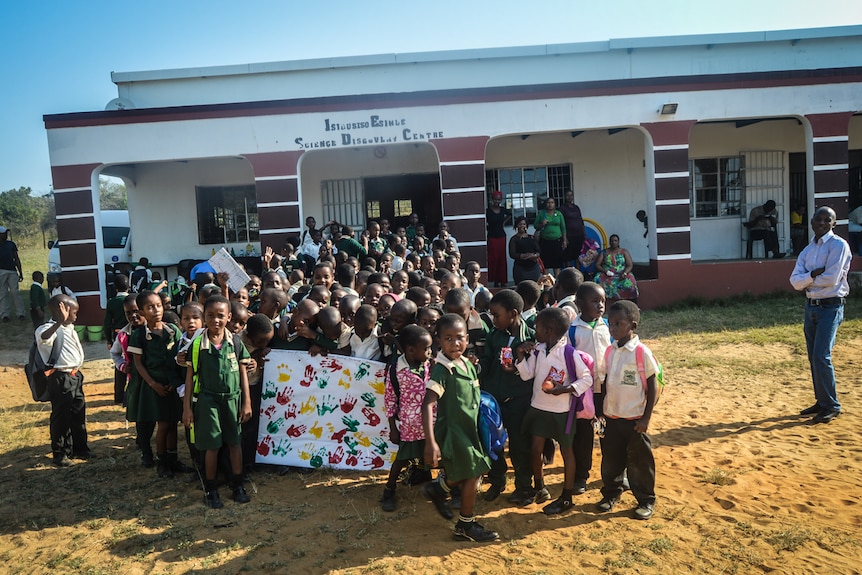Primary school children outside the Isibusiso Esihle Science Discovery Centre in South Africa.