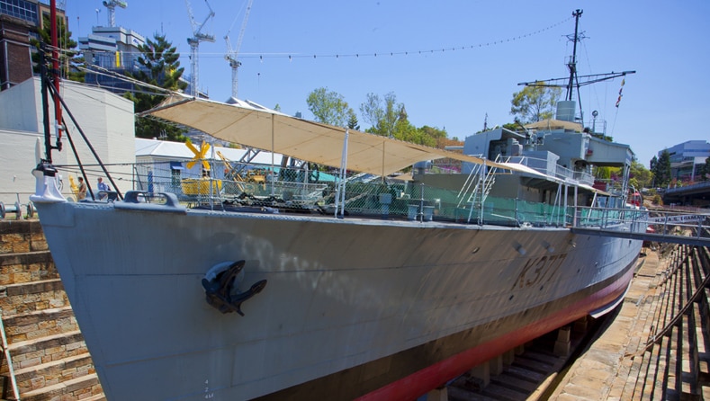 A grey navy ship from World War Two on display at the Queensland Maritime Museum