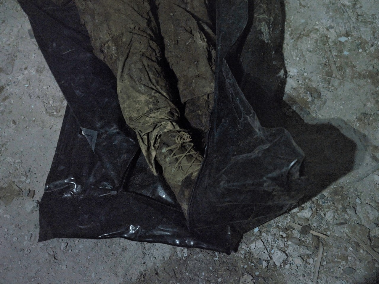 A soldier's legs, in uniform. The rest of his body is not visible.