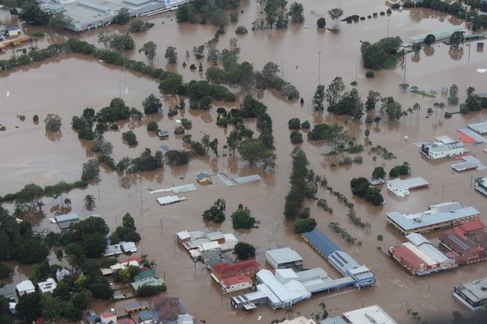 Aerial shot of Lismore showing houses underwater and severe floods.
