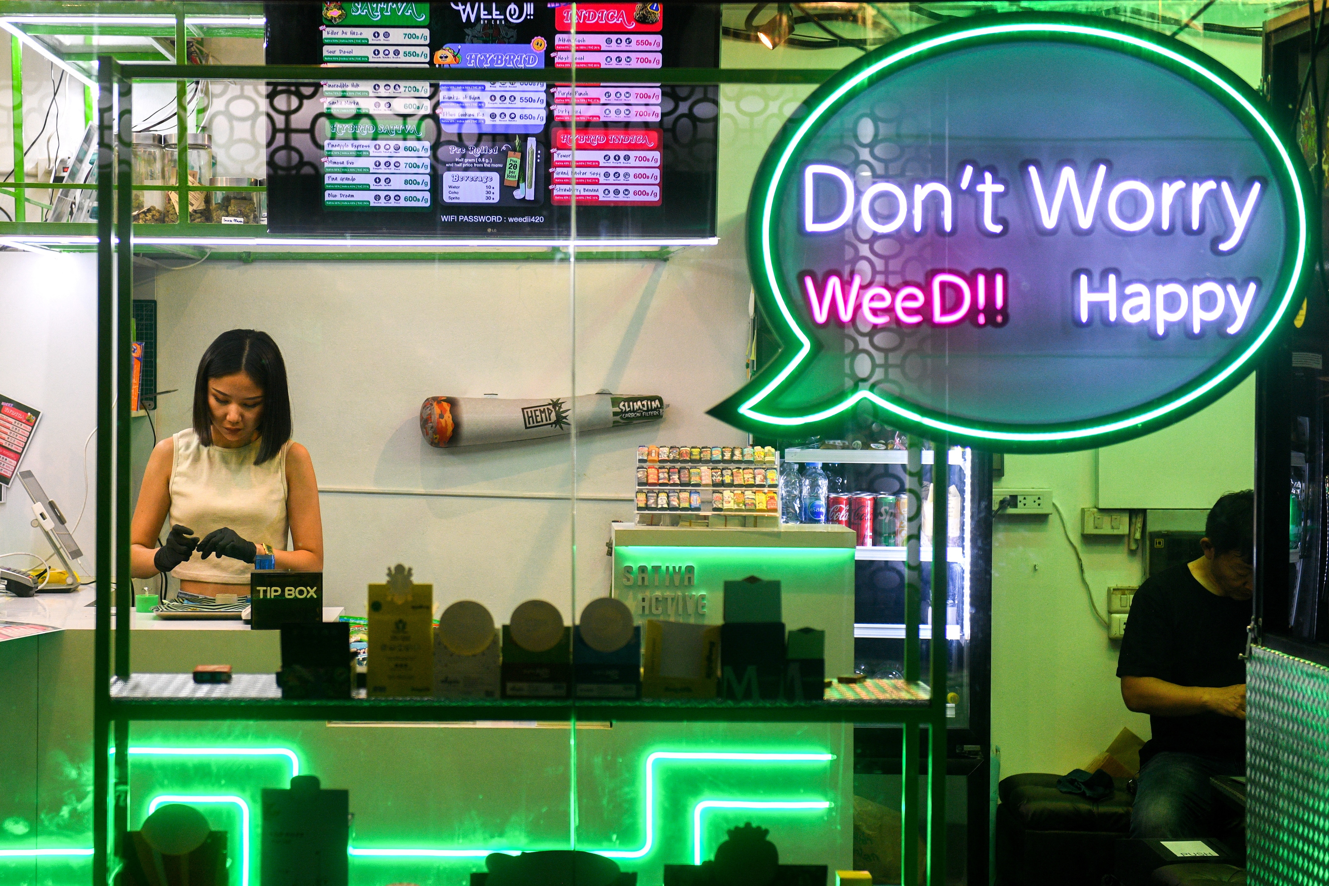 A woman works inside a cannabis shop.