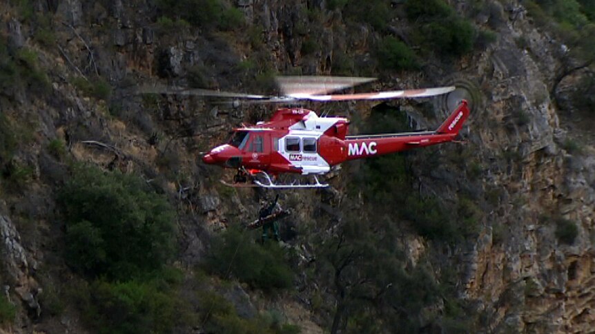 Boy rescued from cliff fall