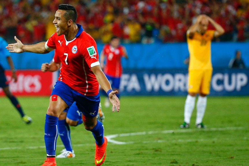 Alexis Sanchez wheels away after scoring against Australia