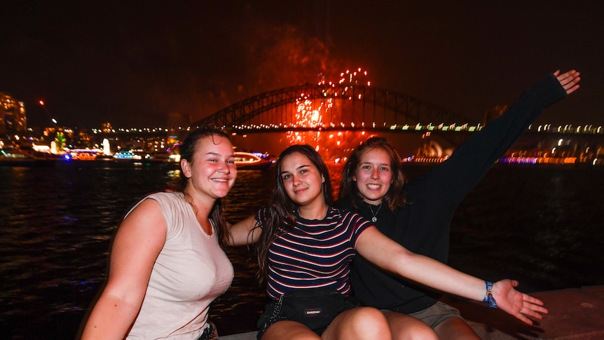 Tourists watch the fireworks