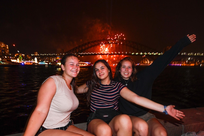 Tourists watch the fireworks