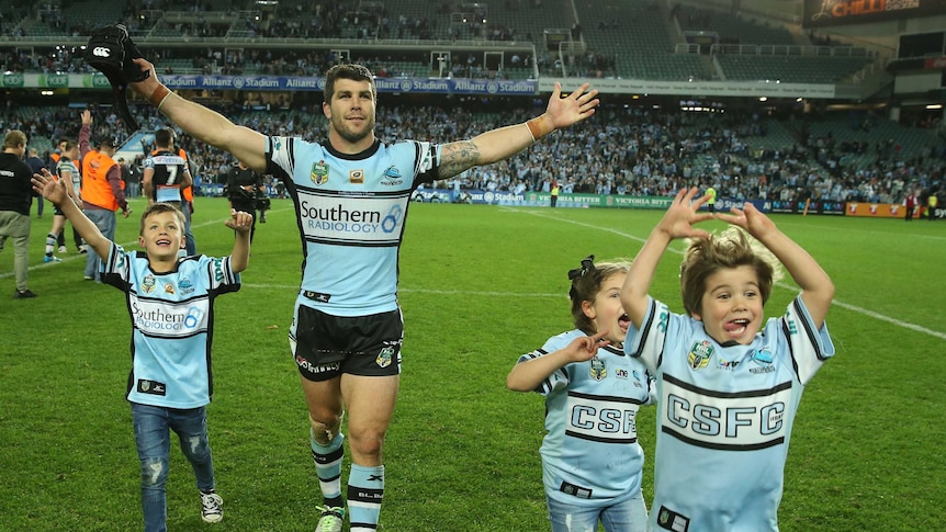 Michael Ennis celebrates Sharks win over Cowboys with his kids