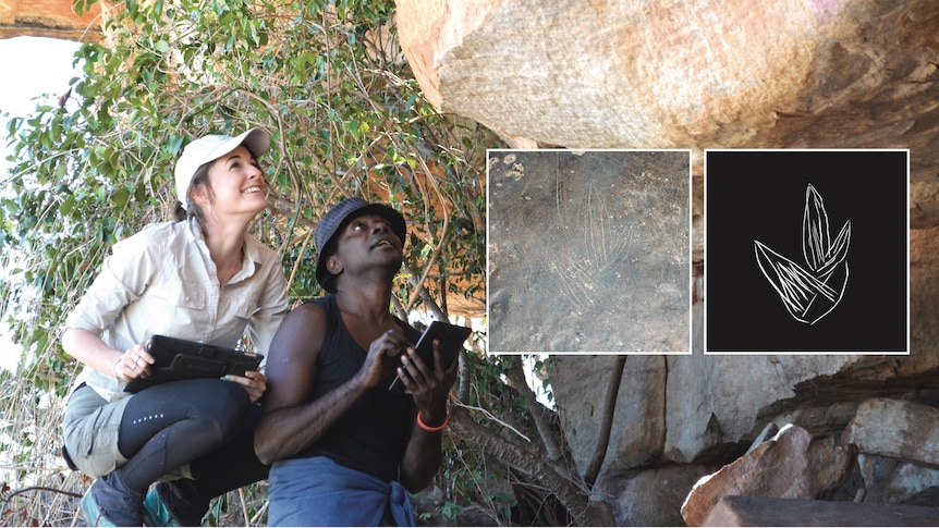 A woman and a man looking at rock art.