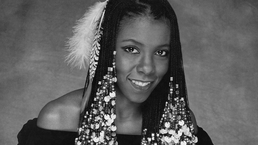 A monochrome shot of Patrice Rushen with beads in her hair