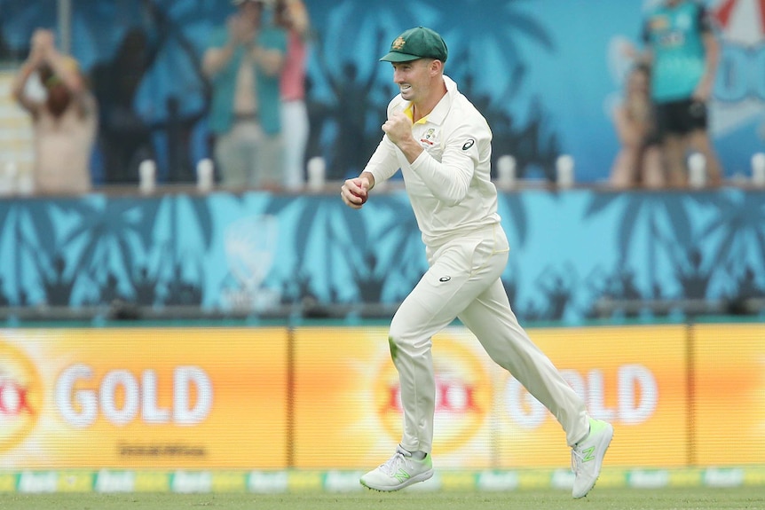 Shaun Marsh oumps his fist after taking a catch to dismiss Dawid Malan.