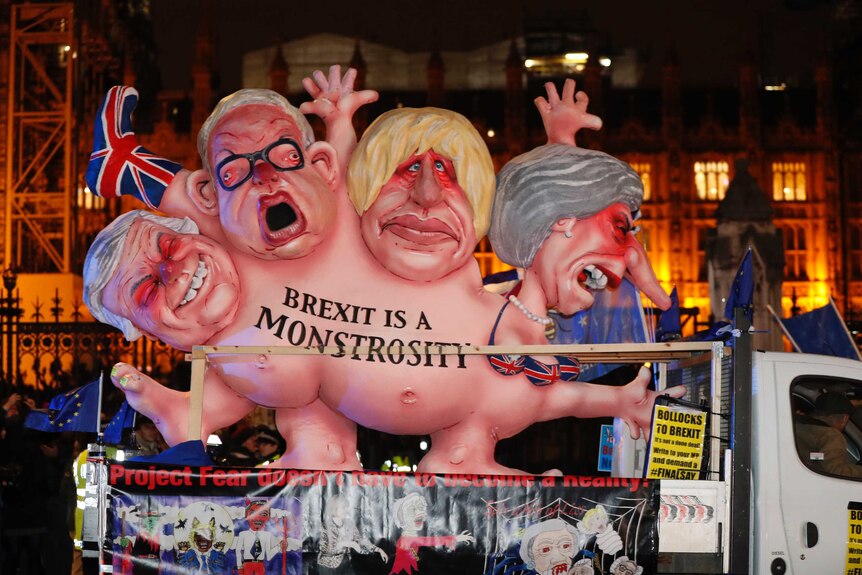 An anti-Brexit effigy is driven around Parliament square