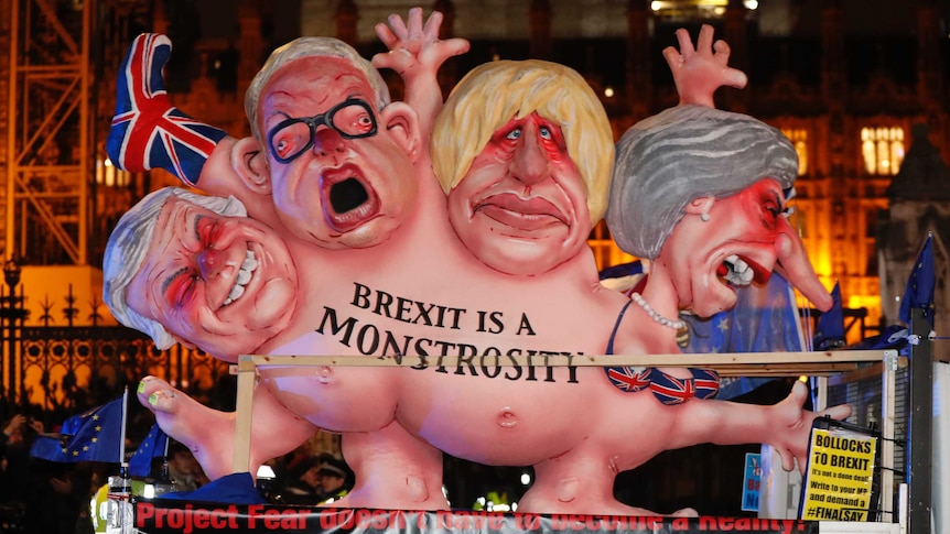 An anti-Brexit effigy is driven around Parliament square