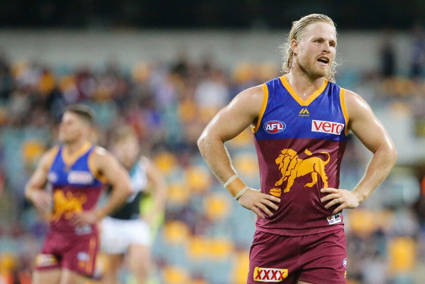 Daniel Rich of the Lions, dejected at the end of Brisbane's big loss to Port Adelaide at the Gabba.